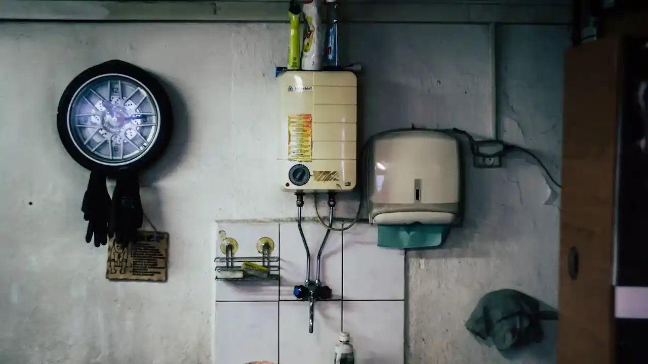 Tankless water heater leak repair in La Mirada: wall-mounted tankless water heater above a sink