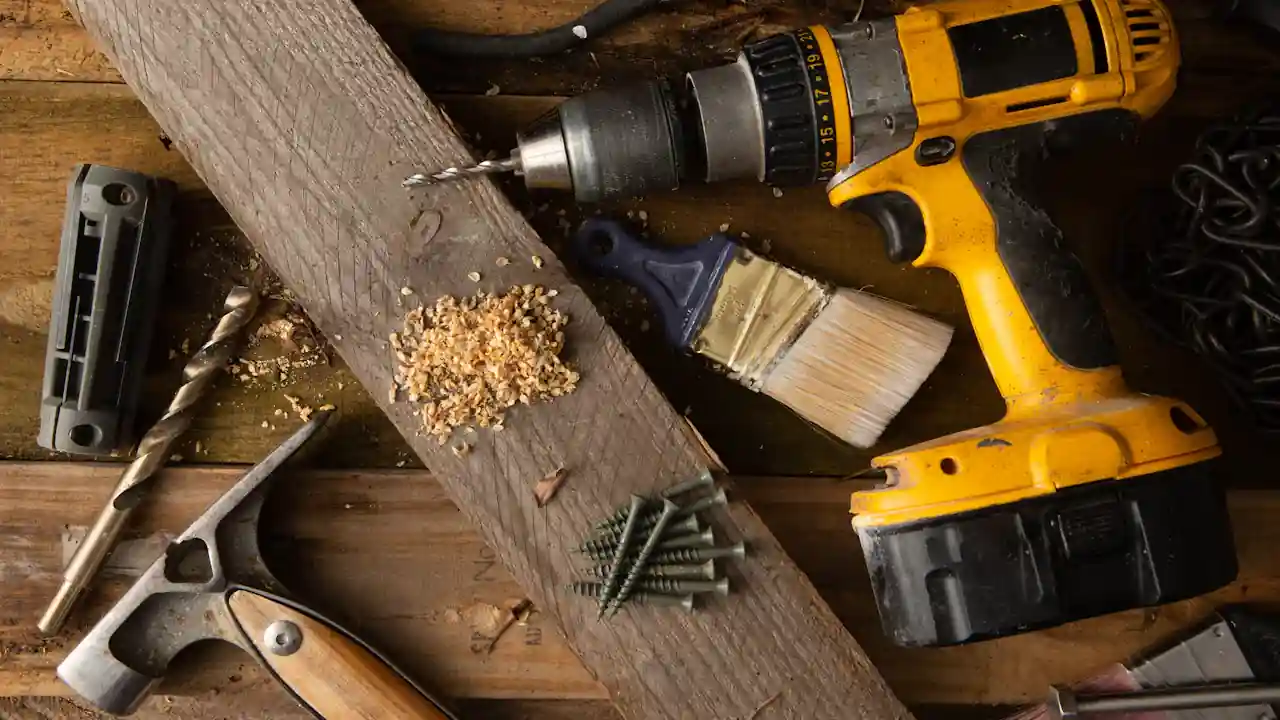 Water heater leak repair in La Mirada Landmark: plumbing and repair tools on a workbench
