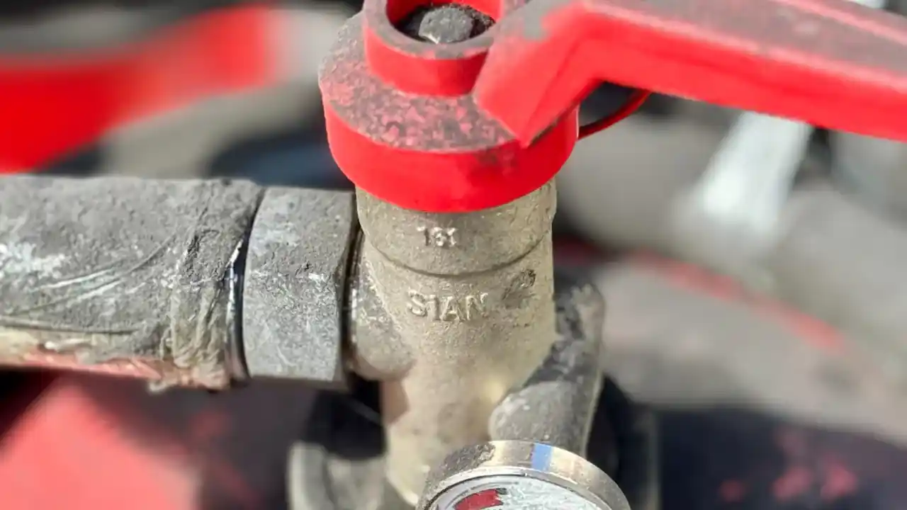 Water heater pressure testing in La Mirada: close-up of a valve with a pressure gauge
